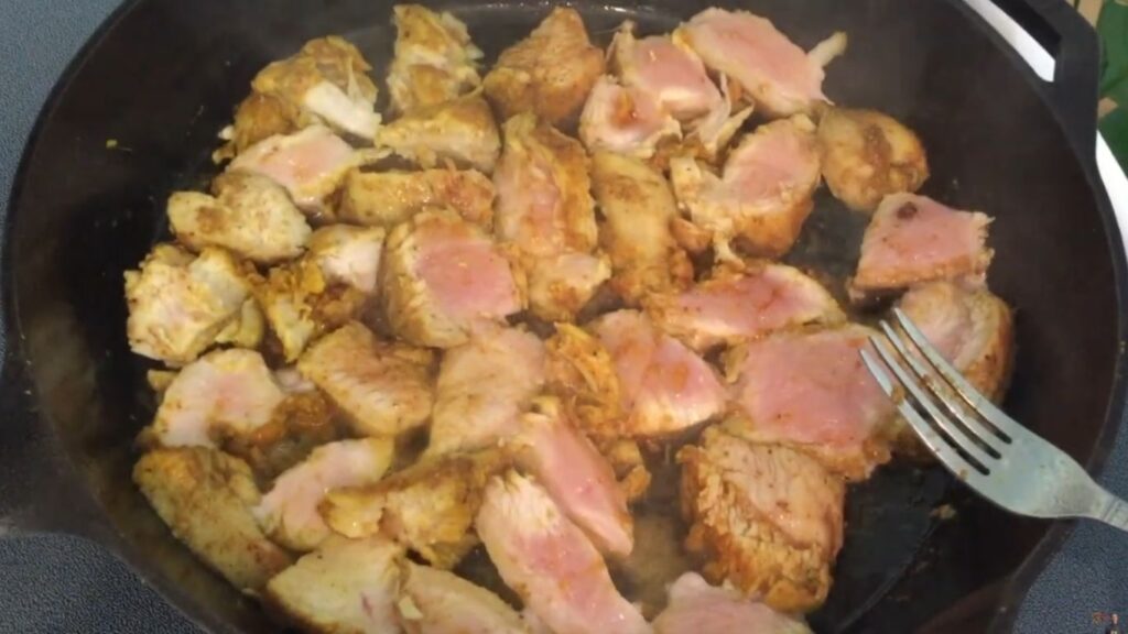 Gluten-Free Chicken Biryani | A Simple Twist on a Classic 6 A hot plate of gluten-free chicken biryani, garnished with coriander, mint, and fried onions, served with raita and a salad for a satisfying meal